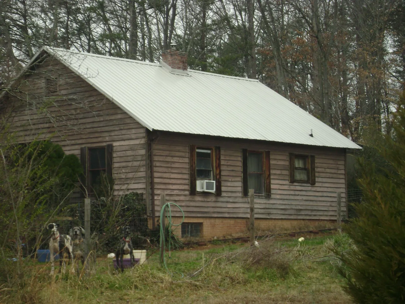 White metal roof on an old wood sided farmhouse, from a Asphalt Shingle Roof Repair job in Greenwood Lake